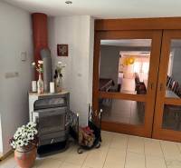 A fireplace in commercial premises with decorations and a view of the celebration room.