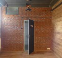 Brick wall, wooden decor floor, entrance to the room in warehouses and halls.