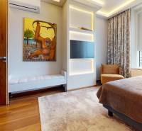 Bedroom in a 3-room apartment with art, wood-patterned flooring, and a view.