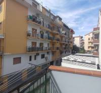 View of apartment buildings on 1 Maggio Street in Scalea from the balcony of a 2-room apartment.