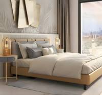 Elegant bedroom in a studio apartment with stylish decorations and a city view.
