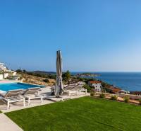 A holiday apartment in Rogoznica with a sea view and a pool on the terrace.