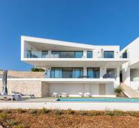 A holiday apartment in Rogoznica with a garden, terrace, and sun loungers by the pool.