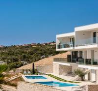 A holiday apartment in Rogoznica with a pool and terrace, countryside view.