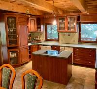 Wooden cladding, wood-decor flooring, kitchen unit and island, recreational plots.