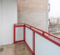A balcony with a red railing, view of Drobného Street in Bratislava - Dúbravka.