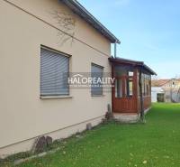 A family house in Rimavská Sobota with a glazed terrace and a well-maintained garden.