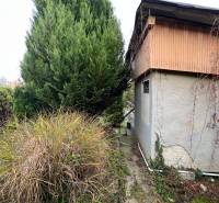 A cottage on Pod Srdcom Street in Bratislava - Devínska Nová Ves, surrounded by greenery and trees.