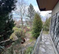 A cottage in Bratislava - Devínska Nová Ves on the street Pod Srdcom, surrounded by trees and plants.