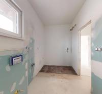A bathroom in a family house prepared for the installation of sanitary fixtures.