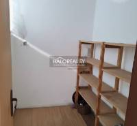 Pantry with a light shelf and a wooden decor floor in a 3-room apartment.