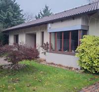A family house in Bohdanovce nad Trnavou with a landscaped garden and winter decorations.