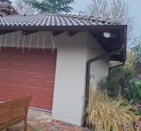 Family house in Bohdanovce nad Trnavou, garage with a red door, surrounding greenery.
