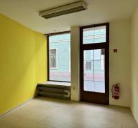 Commercial premises with tiles and radiators, suitable for business.