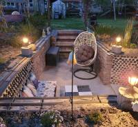 A family house in Okoličná na Ostrove with illuminated outdoor seating and garden design.
