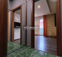 In the 2-room apartment, you can see a hallway with a green ceramic floor.