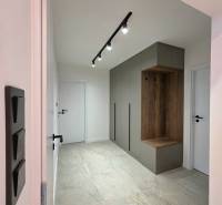 Hallway in a 3-room apartment with a built-in wardrobe and spot lighting.