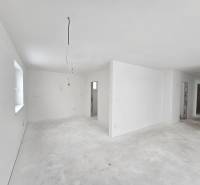 Interior of a family house with white walls and lighting preparation.