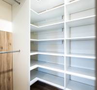 Built-in wardrobe with shelves and a hanging rod in a 2-room apartment.