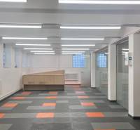 Commercial premises with a colorful floor and glass partitions, suitable for offices or operations.