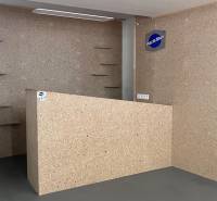 Interior of commercial spaces with wooden decor and shelves on the wall.