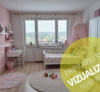 A children's room with pink walls and a wooden decor floor in a 3-room apartment.