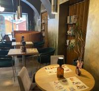 Interior of gastro spaces with wooden decor and wall decorations.