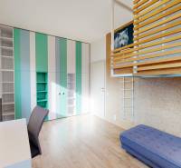 A children's room with a bunk bed and a desk in a 4-room apartment.