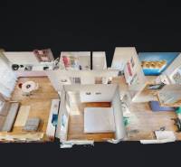 3D view of the layout of a 4-room apartment with a wooden decor floor.