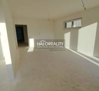 Interior with white walls and windows in a family house, ready for completion.