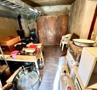A warehouse with various equipment and a wooden decor floor in a family house.