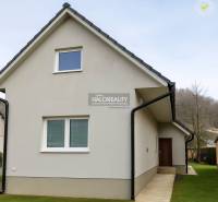 A family house in Kľačno with an attic and grassy surroundings.