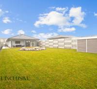 Family house on Mostová in Galanta with a grassy yard and stone decoration.