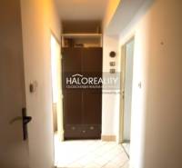 A hallway in a 3-room apartment with a built-in wardrobe and a ceiling light.