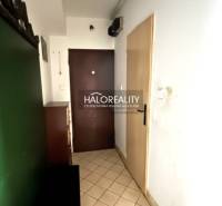 Entrance hallway of a 3-room apartment with tiles and furniture.