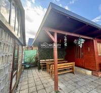 Wooden gazebo with a table and benches in the gardens of Spišská Nová Ves.