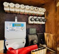 Electrical distribution box in a family house with fuses and an electricity meter.