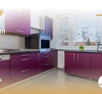A kitchen unit with purple cabinets and a gray countertop in a 4-room apartment.