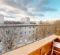 View of buildings and trees from a balcony in Bratislava, Ružinov, on Trebišovská Street.