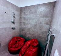 Shower corner with red bean bags in offices.