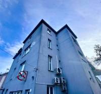 An office building on M.R. Štefánik Street in Trenčín under the blue sky.