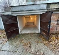 Open garages on Priekopy Street in Bratislava - Ružinov, surrounded by autumn leaves.