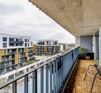 The balcony of a 3-room apartment with a view of modern buildings in Petržalka on Fialová Street.
