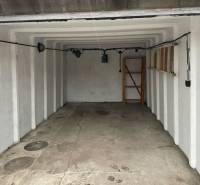 A look into the garage on Prístavná Street in Bratislava - Ružinov with shelves and lighting.