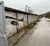 Garages on Prístavná Street in Bratislava - Ružinov with rectangular metal doors.