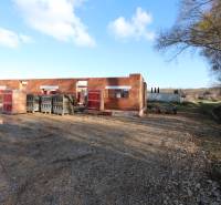 Construction of a family house on Drieňová Street in Nitra, unfinished brick walls in nature.
