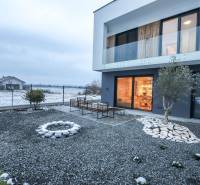Family house in Modrovka on Modrovka Street with a terrace and a gravel yard.