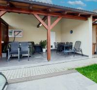Terrace of a family house on Školská Street in Senec with outdoor seating and a shelter.