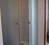 The image shows a shower enclosure with curved doors, on Štúrova Street.
