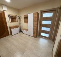 Entrance hall with practical storage furniture and light wood-patterned flooring in a 4-room apartment.